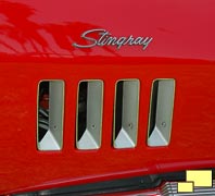 Four vertical front fender louvers below Stingray emblem on 1969 Corvette
